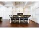 Stunning kitchen with black marble backsplash, custom cabinetry, and spacious island at 570 Manor Rd, Maitland, FL 32751