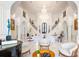 Elegant living room with marble floors, a grand chandelier, and a view of the staircase at 570 Manor Rd, Maitland, FL 32751
