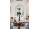 Sophisticated living room with modern sofas and a decorative chandelier in the dining room at 570 Manor Rd, Maitland, FL 32751