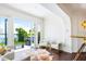 Inviting living space featuring french doors leading to a scenic balcony overlooking lush greenery at 570 Manor Rd, Maitland, FL 32751
