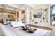 Expansive living room with built-in shelves, modern lighting, and seamless access to the kitchen at 570 Manor Rd, Maitland, FL 32751