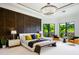 Spacious main bedroom features a tray ceiling, backyard views, and a cozy sitting area at 570 Manor Rd, Maitland, FL 32751