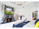 Bright main bedroom with a fireplace, marble accent wall, wet bar, and access to backyard views at 570 Manor Rd, Maitland, FL 32751