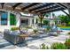 Stylish outdoor patio with comfortable seating, pergola, and beautifully landscaped backyard, perfect for entertaining at 570 Manor Rd, Maitland, FL 32751