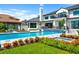 Stunning pool area with a long pool and spa, complemented by lush landscaping and a well-maintained lawn at 570 Manor Rd, Maitland, FL 32751