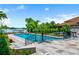 Backyard pool and lounge area with lake access and plenty of space for entertaining at 570 Manor Rd, Maitland, FL 32751