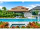 Backyard pool with water features and meticulous landscaping at 570 Manor Rd, Maitland, FL 32751