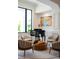Cozy sitting area with a modern piano, art, and comfortable seating at 570 Manor Rd, Maitland, FL 32751
