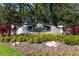View of the Legacy of Leesburg community sign surrounded by lush foliage at 5799 Linen Bluff Pl, Leesburg, FL 34748