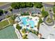 Aerial view of the Legacy of Leesburg community resort-style pool and tennis court at 5799 Linen Bluff Pl, Leesburg, FL 34748