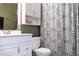 Charming bathroom featuring classic fixtures, vanity with cabinet, and coordinated decor at 5961 Windhover Dr # F05, Orlando, FL 32819