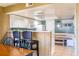 Open kitchen with a breakfast bar and adjacent dining area at 5961 Windhover Dr # F05, Orlando, FL 32819
