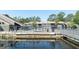 Community pool view highlighting the well-maintained grounds and serene water reflections at 5961 Windhover Dr # F05, Orlando, FL 32819