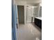 Bathroom featuring a glass shower door, sleek vanity, and tile flooring at 604 Sarner Pass Way, Winter Haven, FL 33881
