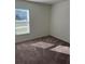 A carpeted bedroom with a window providing natural light, ready for personalization at 604 Sarner Pass Way, Winter Haven, FL 33881