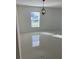 Bright living room with a pendant light fixture and sunlit tile flooring at 604 Sarner Pass Way, Winter Haven, FL 33881