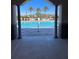 View of a community pool with palm trees and lounge chairs at 604 Sarner Pass Way, Winter Haven, FL 33881