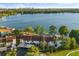 Enjoy this aerial view of the property with waterfront access, mature trees and a sparkling swimming pool at 640 Killarney Bay Ct # 4, Winter Park, FL 32789