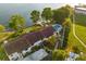 This aerial view shows a sparkling swimming pool, lush landscaping, and waterfront access at 640 Killarney Bay Ct # 4, Winter Park, FL 32789