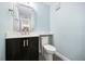 Powder room features modern vanity, decorative mirror, and tiled flooring at 640 Killarney Bay Ct # 4, Winter Park, FL 32789