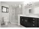 This renovated bathroom features glass enclosed shower and modern dual sink vanity at 640 Killarney Bay Ct # 4, Winter Park, FL 32789