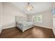 This bedroom offers hardwood floors, and a ceiling fan at 640 Killarney Bay Ct # 4, Winter Park, FL 32789