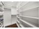 Spacious walk-in closet features custom shelving and ample storage, perfect for organization and accessibility at 640 Killarney Bay Ct # 4, Winter Park, FL 32789