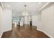 Elegant dining area with a crystal chandelier flows into the stylish kitchen and living spaces at 640 Killarney Bay Ct # 4, Winter Park, FL 32789