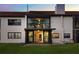 Exterior view shows a two-story home with a patio, balcony, and tile roof and an interior staircase at 640 Killarney Bay Ct # 4, Winter Park, FL 32789