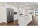 Modern kitchen features stainless steel appliances, white cabinetry, and a functional island at 640 Killarney Bay Ct # 4, Winter Park, FL 32789