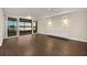 Spacious living room with wood floors and lake view through sliding glass doors at 640 Killarney Bay Ct # 4, Winter Park, FL 32789