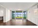 Spacious living room features hardwood floors and large sliding glass doors that open to the screened patio at 640 Killarney Bay Ct # 4, Winter Park, FL 32789