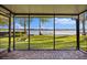 Beautiful screened patio overlooking the lush lawn and serene lake at 640 Killarney Bay Ct # 4, Winter Park, FL 32789