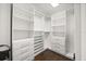 This spacious walk-in closet is well organized with shelving and drawers at 640 Killarney Bay Ct # 4, Winter Park, FL 32789