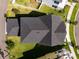 Aerial view of a home showing roof, yard, and neighborhood at 7409 Inlet Pt, Celebration, FL 34747
