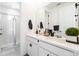 The bathroom features double sinks, a spacious shower with a glass door, and modern fixtures at 7409 Inlet Pt, Celebration, FL 34747