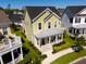 Charming two-story home with covered porch and manicured landscaping at 7409 Inlet Pt, Celebration, FL 34747