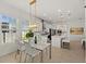 Well-designed kitchen featuring a dining area, white countertops, stainless steel appliances, and island seating at 7409 Inlet Pt, Celebration, FL 34747