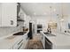 Updated kitchen with stainless steel appliances, white quartz countertops, and a center island with a sink at 7409 Inlet Pt, Celebration, FL 34747