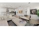 Bright open concept with a stylish kitchen island, living space, neutral furnishings, and sleek stainless appliances at 7409 Inlet Pt, Celebration, FL 34747