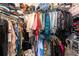 Spacious walk-in closet with custom shelving and organized storage for a convenient wardrobe solution at 7409 Inlet Pt, Celebration, FL 34747