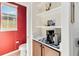 Cozy half bath with coffee bar setup, charming decor, and a practical design at 7545 Azalea Cove Cir, Orlando, FL 32807