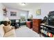 Bedroom featuring a desk, a sofa and multiple dressers at 7545 Azalea Cove Cir, Orlando, FL 32807