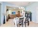 Inviting dining area with chandelier lighting, table, and a view to the connected living room at 7545 Azalea Cove Cir, Orlando, FL 32807