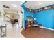 Open foyer showcases hardwood floors, a staircase with white railings, and decorative shelves at 7545 Azalea Cove Cir, Orlando, FL 32807