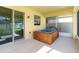 An outdoor spa is located in the screened lanai area with sliding glass door access to the home at 7545 Azalea Cove Cir, Orlando, FL 32807