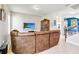 Inviting living room featuring a brown sectional sofa, tile floors, and a staircase to the upper level at 7545 Azalea Cove Cir, Orlando, FL 32807