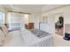 Spacious main bedroom with an ensuite bathroom, sliding door, dresser and view of the staircase at 7545 Azalea Cove Cir, Orlando, FL 32807