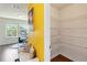 Bright view of the office with large art adjacent to a pantry featuring wire shelving at 7545 Azalea Cove Cir, Orlando, FL 32807