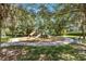 A well-maintained community playground features modern equipment and ample shade for enjoyment at 7545 Azalea Cove Cir, Orlando, FL 32807